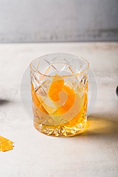 Boozy tasty Old Fashioned Cocktail with bourbon whiskey, sugar cube and aromatic bitters