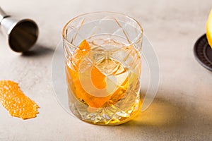 Boozy tasty Old Fashioned Cocktail with bourbon whiskey, sugar cube and aromatic bitters