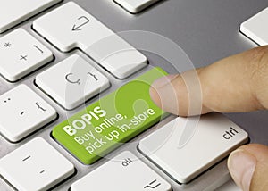 BOPIS buy online, pick up in-store - Inscription on Green Keyboard Key photo