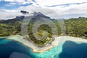 Bora Bora, aerial view from Island with Mount Otemanu, forest, beach and coral reefs. French Poynesia, South Pacific Ocean.