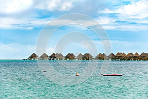 Bora Bora overwater-bungalows  of Bora Bora, luxury resort, hotel, bright green blue lagoon.