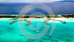 Bora Bora overwater-bungalows of Intercontinental Bora Bora Resort & Thalasso Spa, Hotel, bright green blue lagoon, sapphire sea