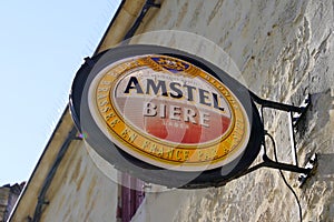 Amstel dutch beer sign round text and logo brand front of restaurant bar pub