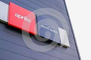 Aprilia moto guzzi Italian motorcycle company sign logo dealership store owned by
