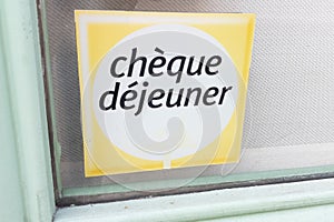 Cheque dejeuner logo brand and text sign lunch voucher on french windows entrance photo