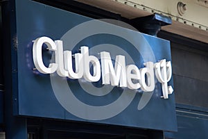 Club Med sign text and logo brand front entrance office travel agency club