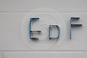 EDF sign logo and brand text on building facade of French multinational electric