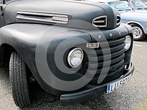 Bordeaux , Aquitaine / France - 06 14 2020 : Ford F100 pickup truck classic car front view in mat black custom paint