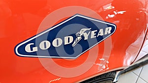 GoodYear tyre logo and text sign on stickers of red racing vintage car