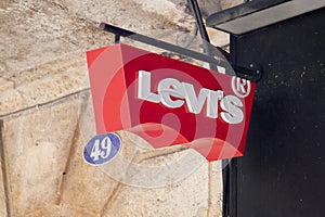 Levi's Jeans sign logo and text brand front wall chain facade store fashion clothes
