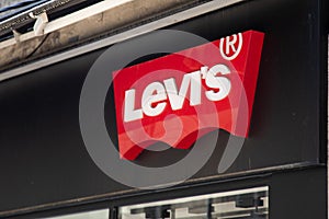 Levis clothing store brand text and shop logo sign Levi's entrance wall facade in