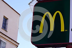 McDonalds logo and text m sign of global chain of fast food restaurant store