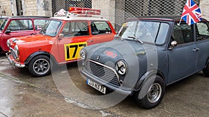Mini cooper exhibition ancient car logo brand and text sign wings front of racing