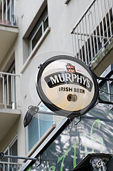 Murphy`s irish beer pub text logo and brand sign bar on wall restaurant cafe in the