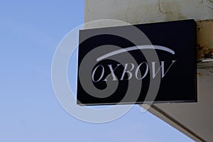 Oxbow logo sign and brand text on store facade clothing shop French fashion retailer