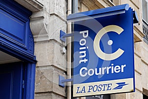 Point courrier La Poste logo and text sign front of Post store in France