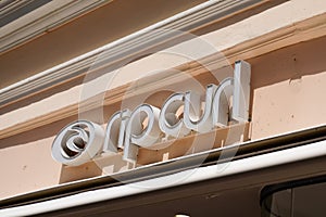 Rip curl  logo sign and brand text on store facade clothing shop entrance sporting