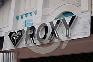 Roxy logo text and sign wall surf brand exterior facade shop of Quiksilver girl store