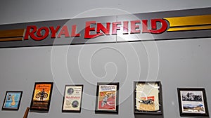 Royal Enfield motorcycles logo brand and text sign on wall interior indian motorcycles