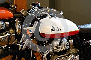 Royal Enfield tank logo sign on motorcycle white red side detail of vintage indian