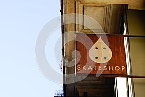 Skateshop text sign on wall building facade store