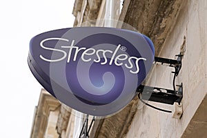 Stressless logo sign in storefront of manufacturer and distributor of mattresses