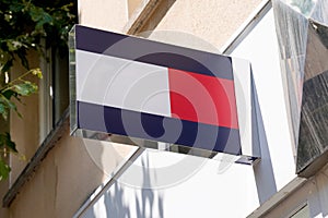 Tommy Hilfiger logo store front of brand premium American clothing company sign shop