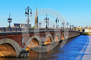 Bordeaux river bridge with St Michel cathedral photo