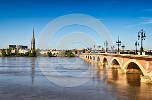 Bordeaux river bridge with St Michel cathedral photo
