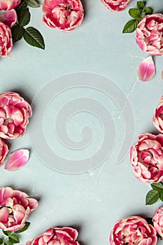 Border of beautiful pink tulips on blue shabby chic background