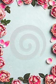 Border of beautiful pink tulips on blue shabby chic background