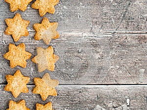 Border of Christmas Star Cookies on Rustic Wood