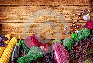 Border of colorful vegetables on wooden background. Organic food concept. Copy space