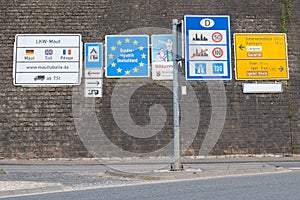 Border crossing to Germany, many road signs inform about speed limits and toll fees on german streets, welcome sign, EU