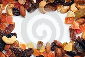 Border of dried fruits and nuts photo