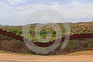 Border Fence Separating the US from Mexico Near Nogales, Arizona photo