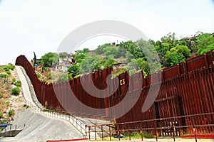 Border Fence Separating the US from Mexico in Nogales, Arizona photo
