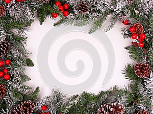 Border, frame from christmas tree branches with pine cones photo