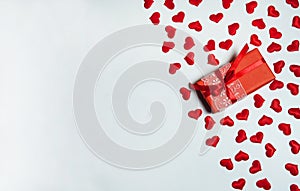 Border of gift box and red hearts on white background.