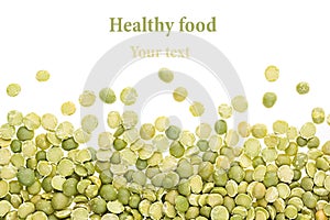 Border of green dry purified peas closeup with copy space on white background.