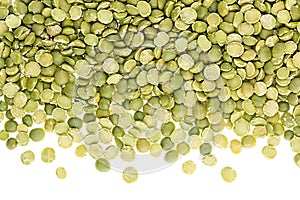 Border of green dry purified peas closeup with copy space on white background.