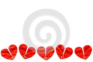 Border of many Red paper broken hearts on white background. Love concept. Divorce.