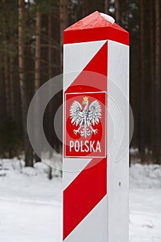 Border post with the emblem of the Polish.