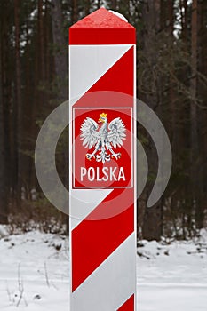 Border post with the emblem of the Polish.