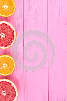 Border from sliced oranges and grapefruits.