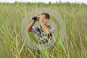 A border war is looking through binoculars