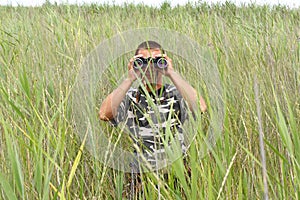 A border war is looking through binoculars