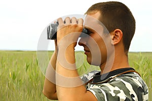 A border war is looking through binoculars