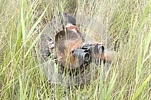 A border war is looking through binoculars