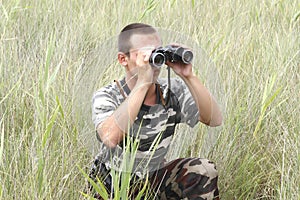 A border war is looking through binoculars